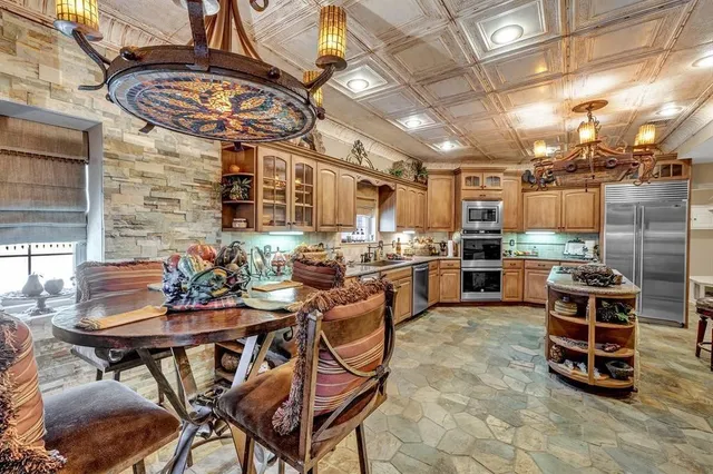 a view of a chairs and table in the kitchen