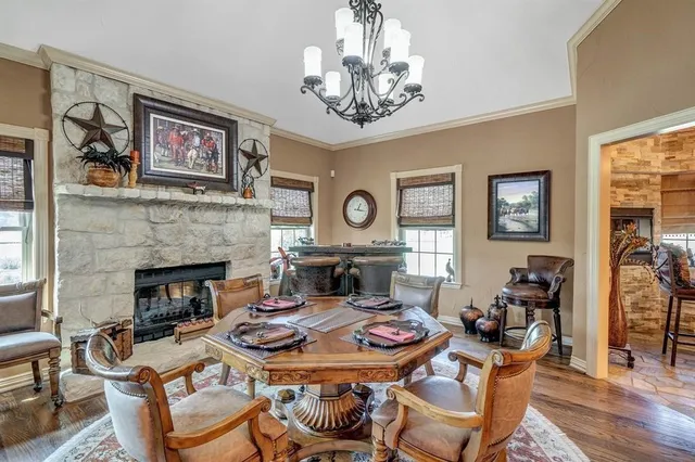 a living room with furniture a table and a fireplace