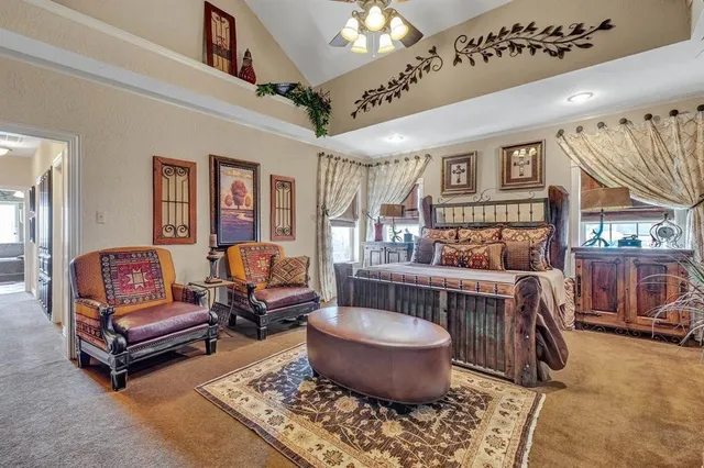 a living room with furniture a rug and a chandelier
