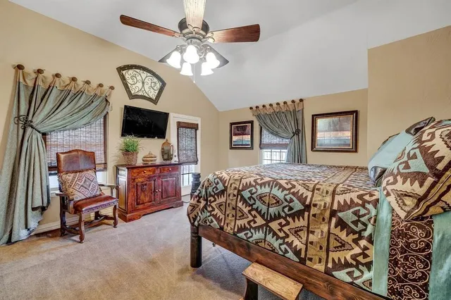 a bed room with a bed and a chair