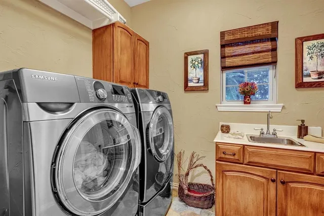 a utility room with dryer and washer