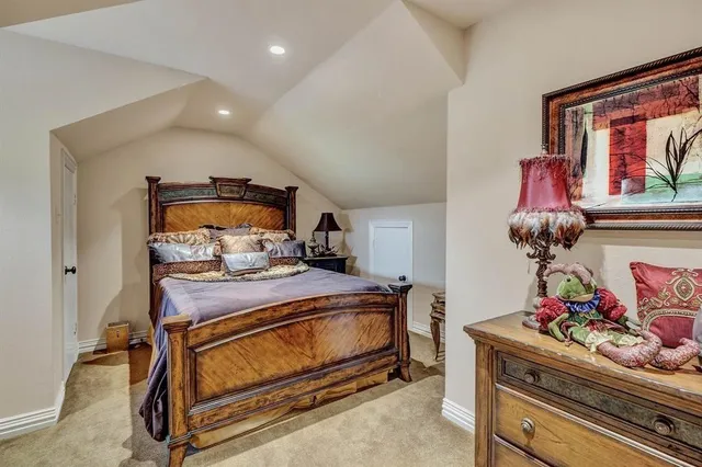 a bed room with a bed and dresser