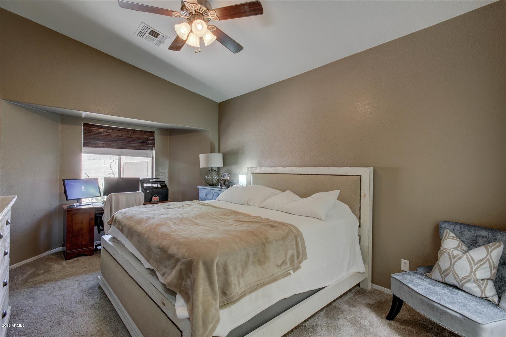 923 South Racine Lane Gilbert, AZ 85296 - Photo 13 of 32 a bedroom with a bed and window