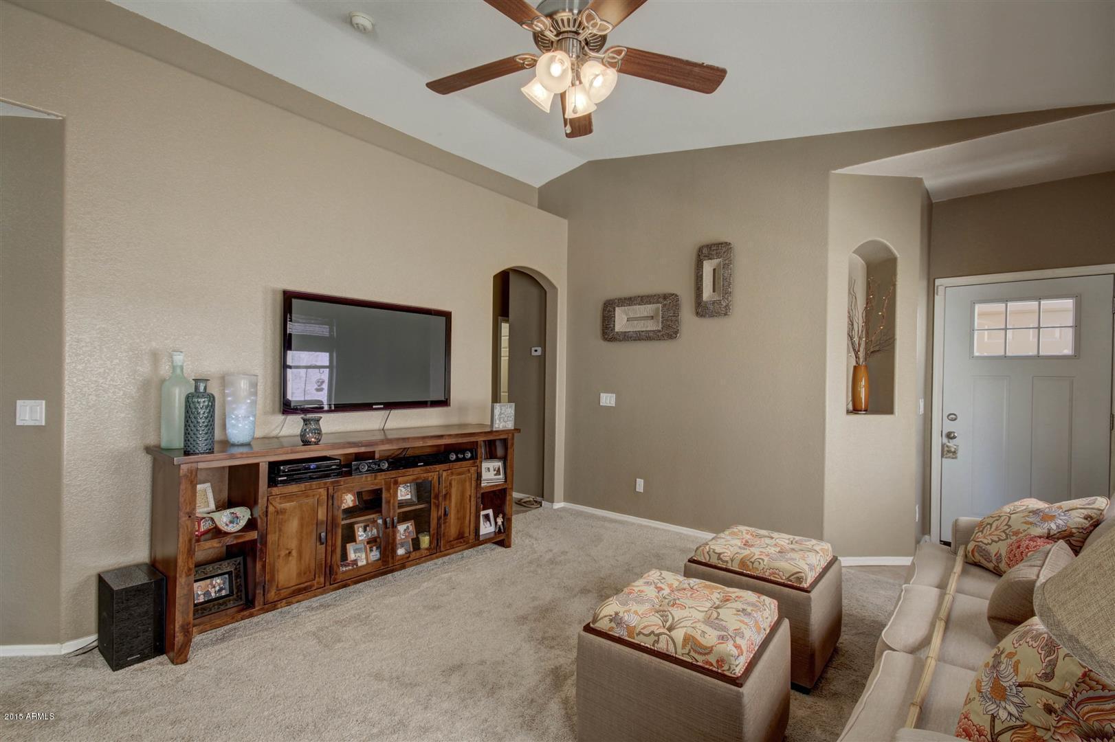 923 South Racine Lane Gilbert, AZ 85296 - Photo 7 of 32 a living room with furniture and a flat screen tv