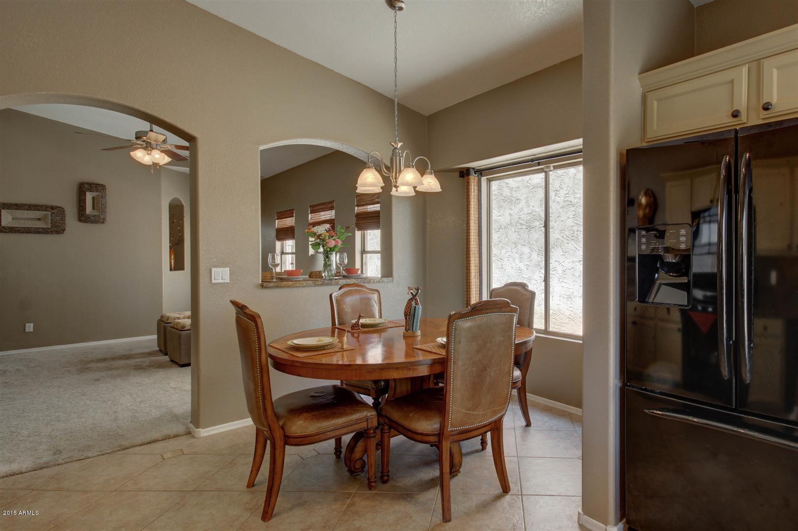 923 South Racine Lane Gilbert, AZ 85296 - Photo 9 of 32 a dining room with furniture and window