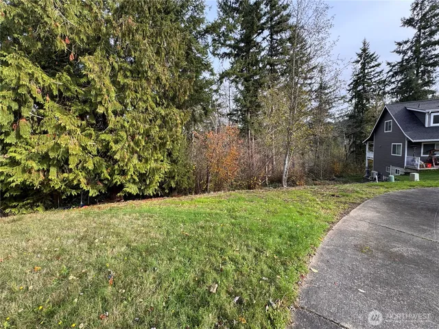 a view of house with yard
