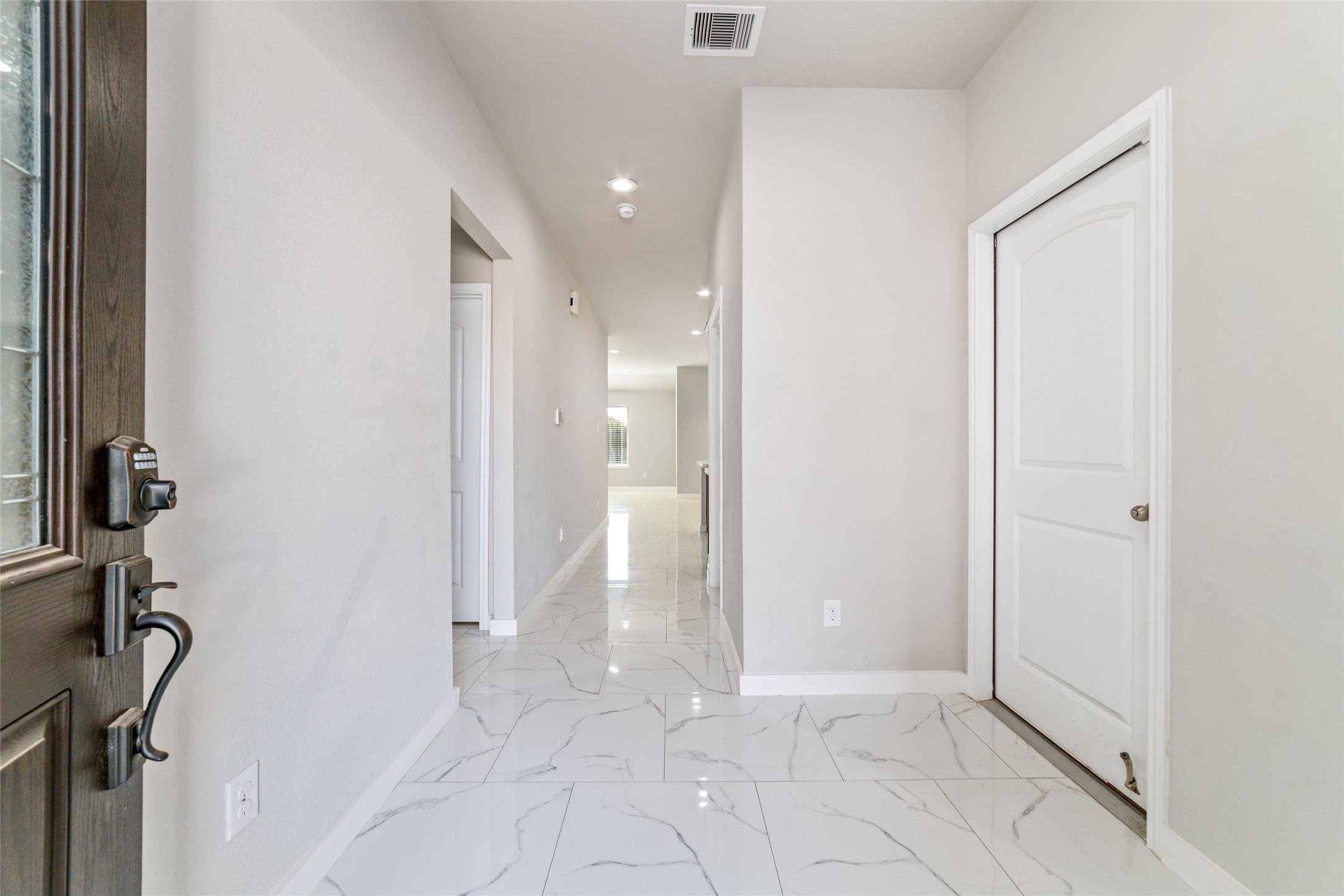 5502 Creekside Ridge Trail Katy, TX 77449 - Photo 4 of 25 a view of a hallway with a bathroom