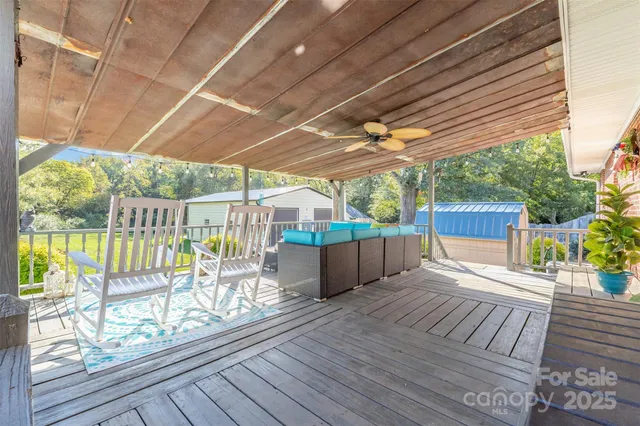 a view of porch with wooden floor