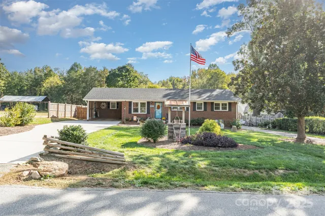 a front view of house with yard and outdoor seating