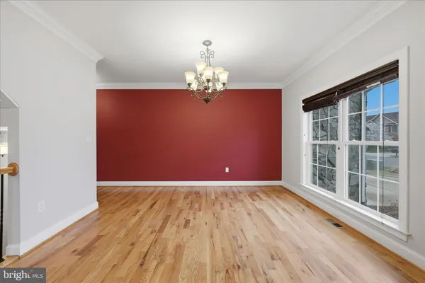 a large kitchen with stainless steel appliances granite countertop plenty wooden cabinets counter space and a sink