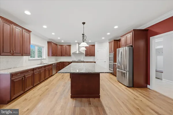 a view of an empty room and a ceiling fan