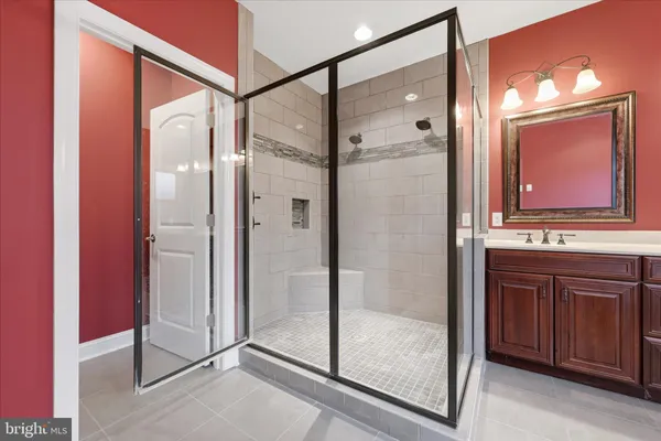 a bathroom with a glass shower door