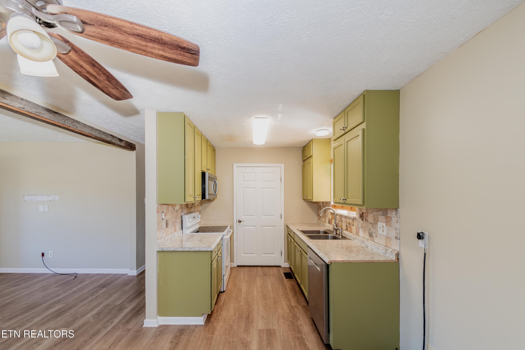 759 Laurel Road Clinton, TN 37716 - Photo 12 of 28 a bathroom with a sink a toilet and mirror