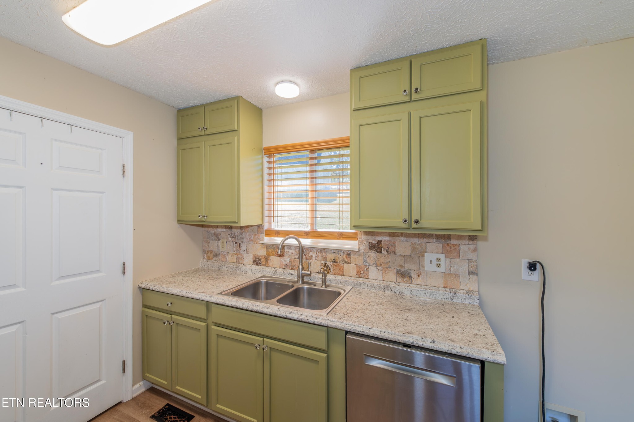 759 Laurel Road Clinton, TN 37716 - Photo 15 of 28 a kitchen with a sink and cabinets