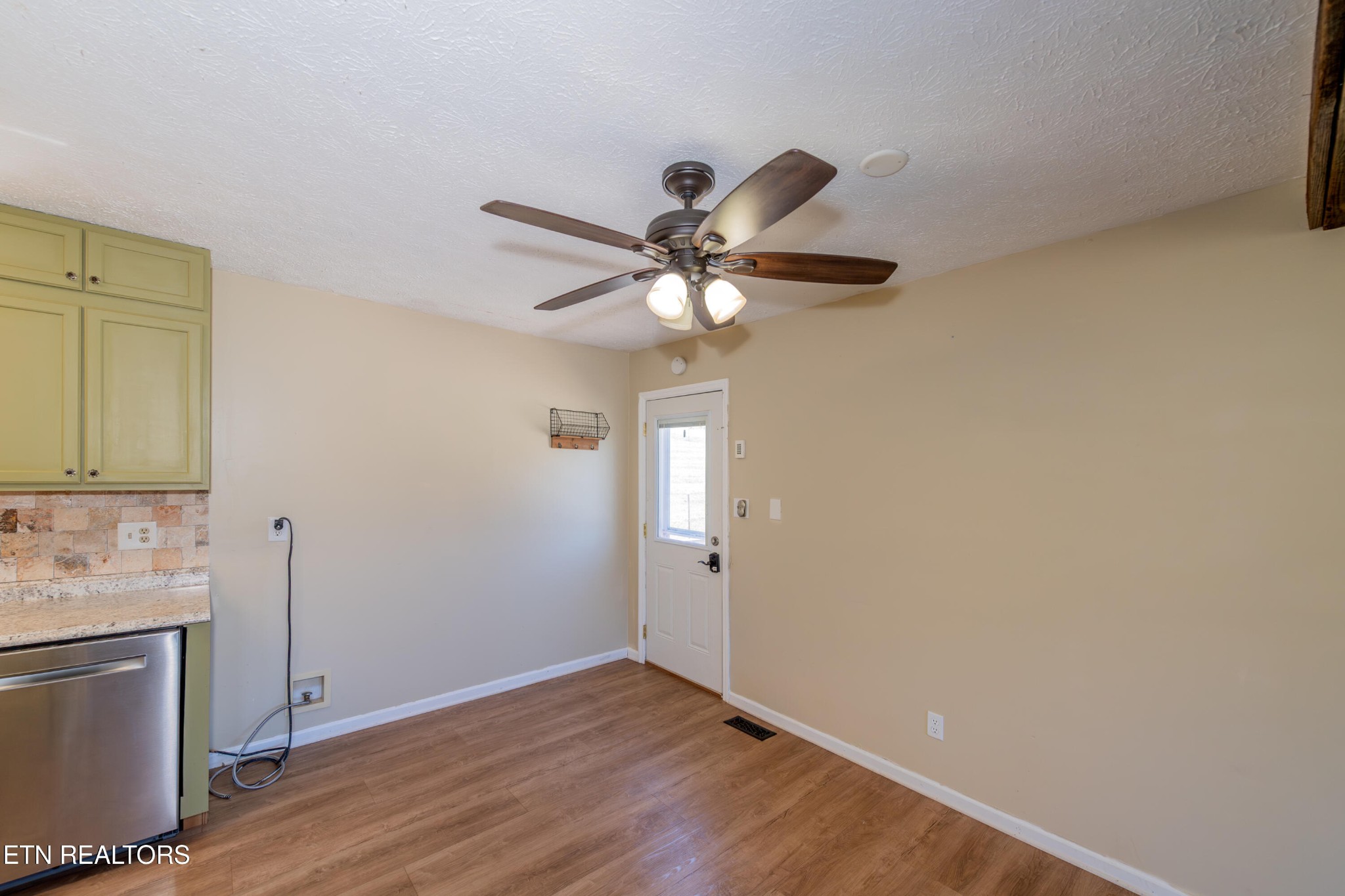 759 Laurel Road Clinton, TN 37716 - Photo 16 of 28 wooden floor in an empty room with a window