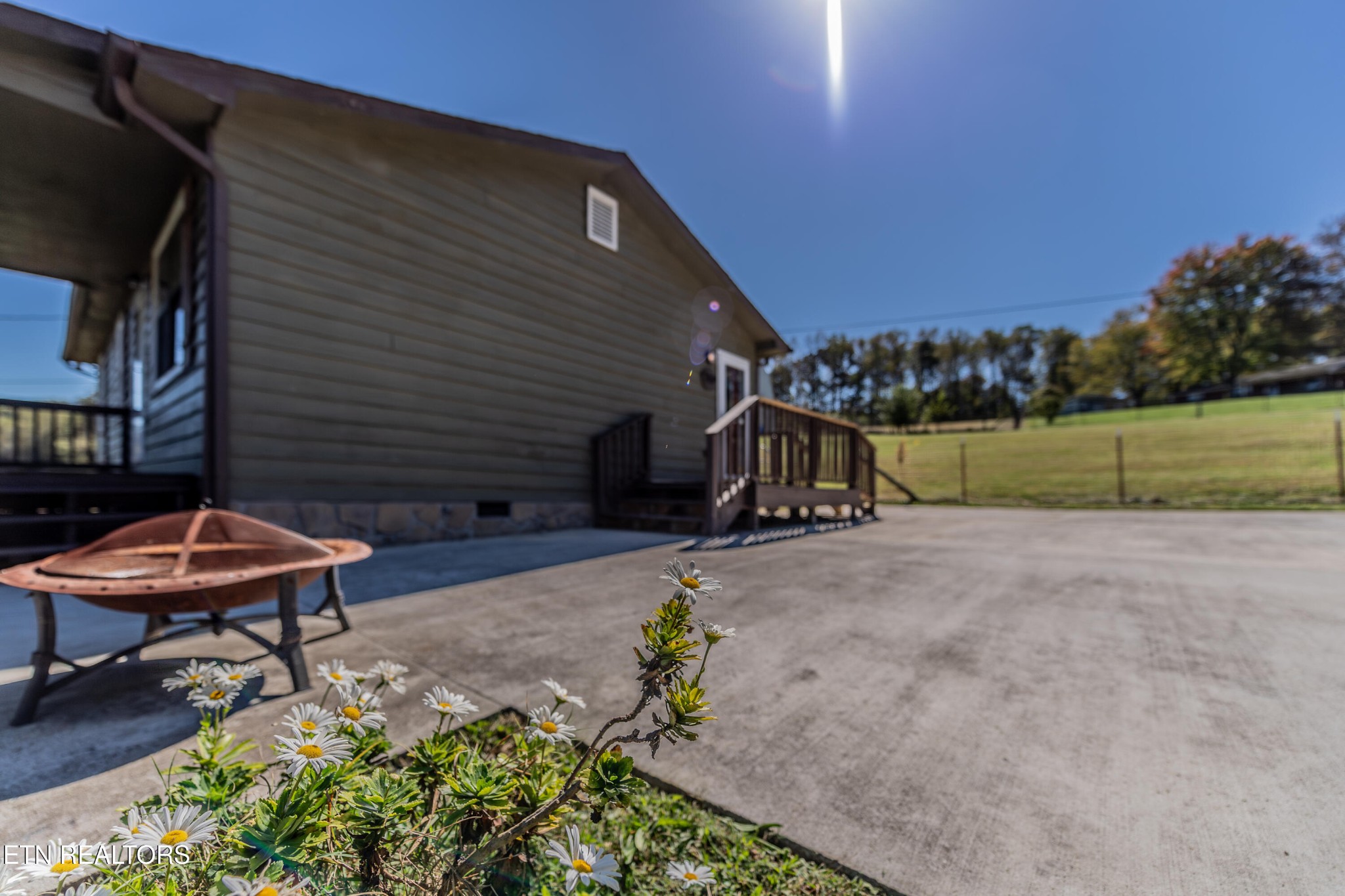 759 Laurel Road Clinton, TN 37716 - Photo 6 of 28 a view of a backyard with sitting area