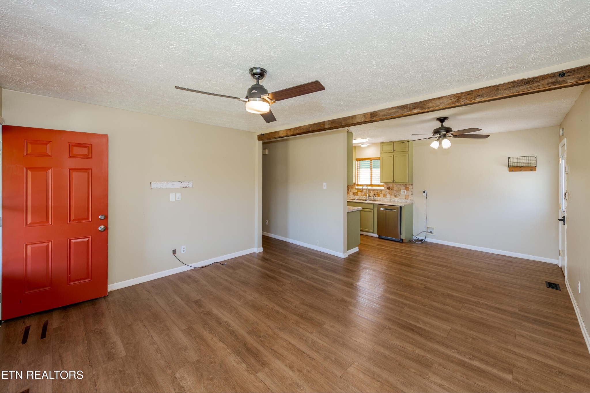 759 Laurel Road Clinton, TN 37716 - Photo 10 of 28 wooden floor in an empty room with a window