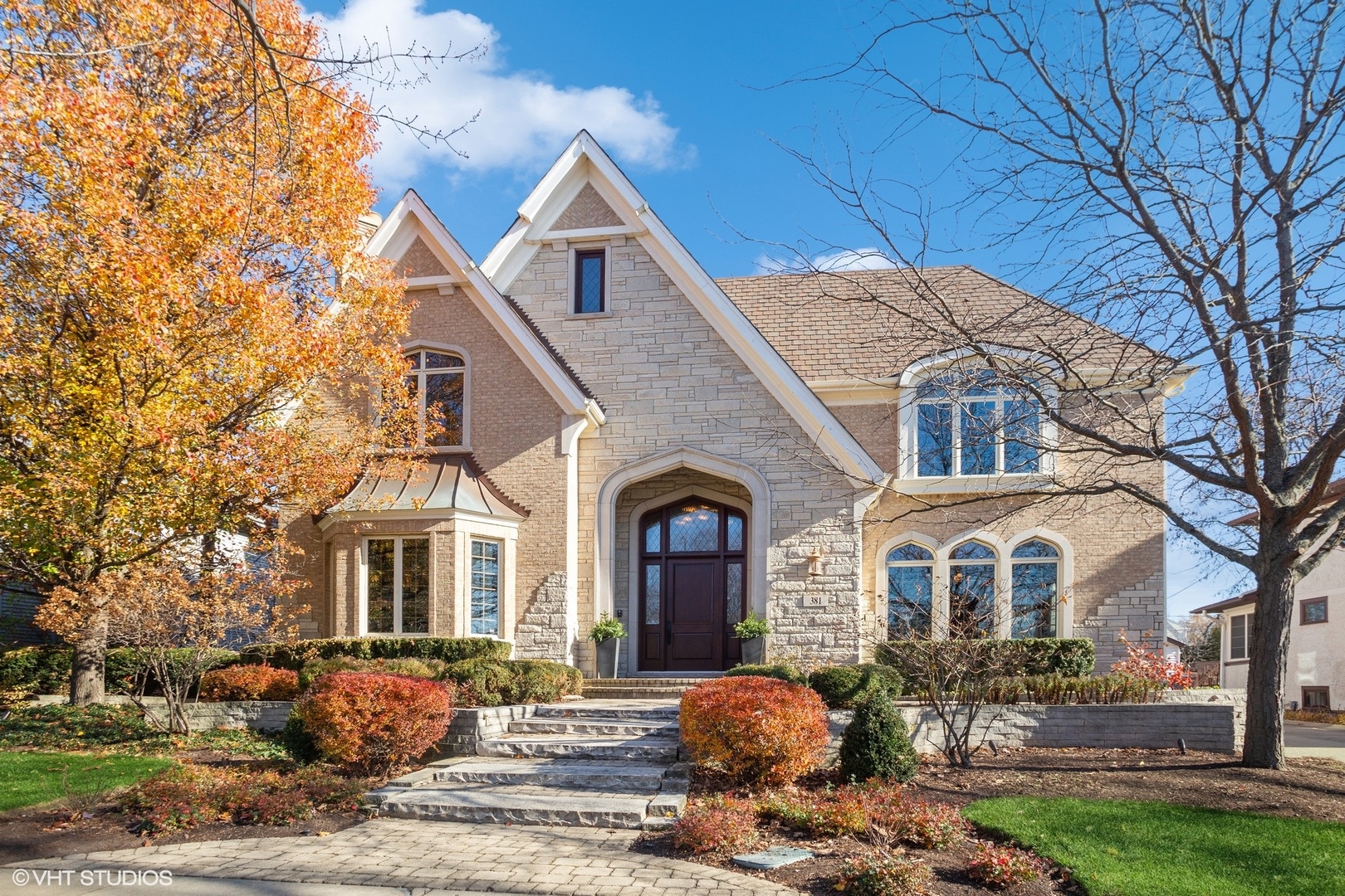 a front view of a house with a yard