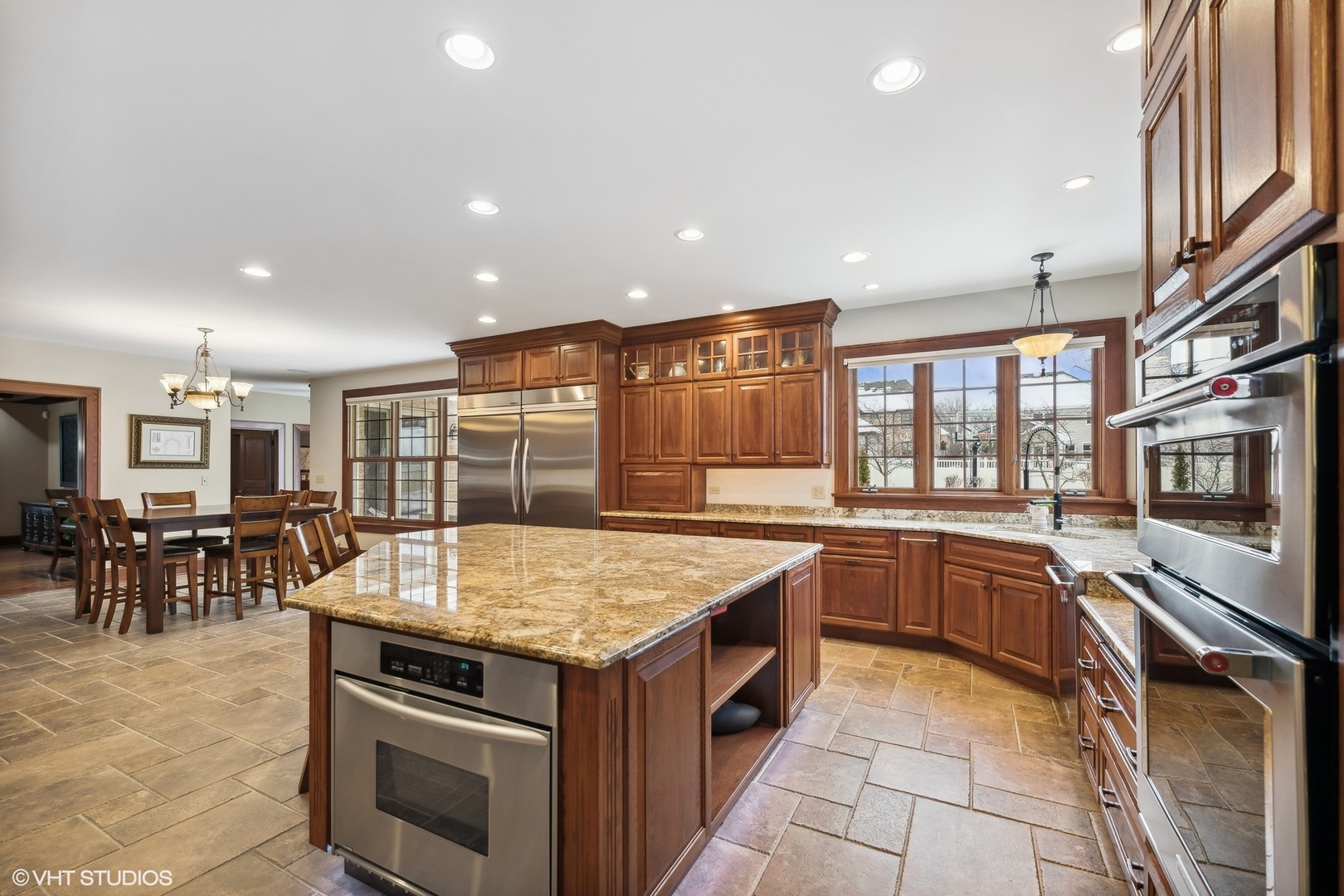 381 Argyle Avenue Elmhurst, IL 60126 - Photo 15 of 63 a kitchen with stainless steel appliances granite countertop a stove and a sink