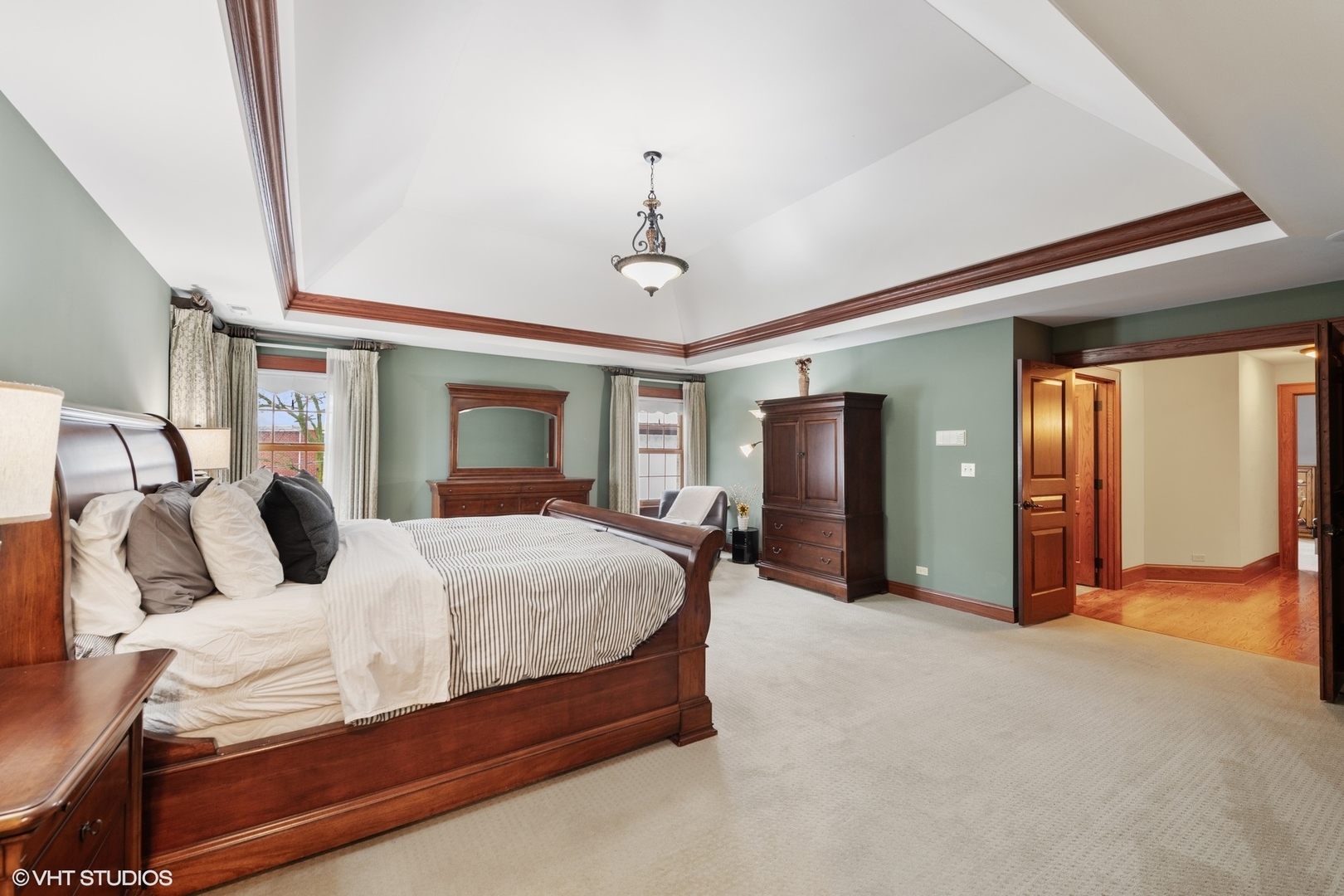 381 Argyle Avenue Elmhurst, IL 60126 - Photo 26 of 63 a bedroom with a large bed and a chandelier