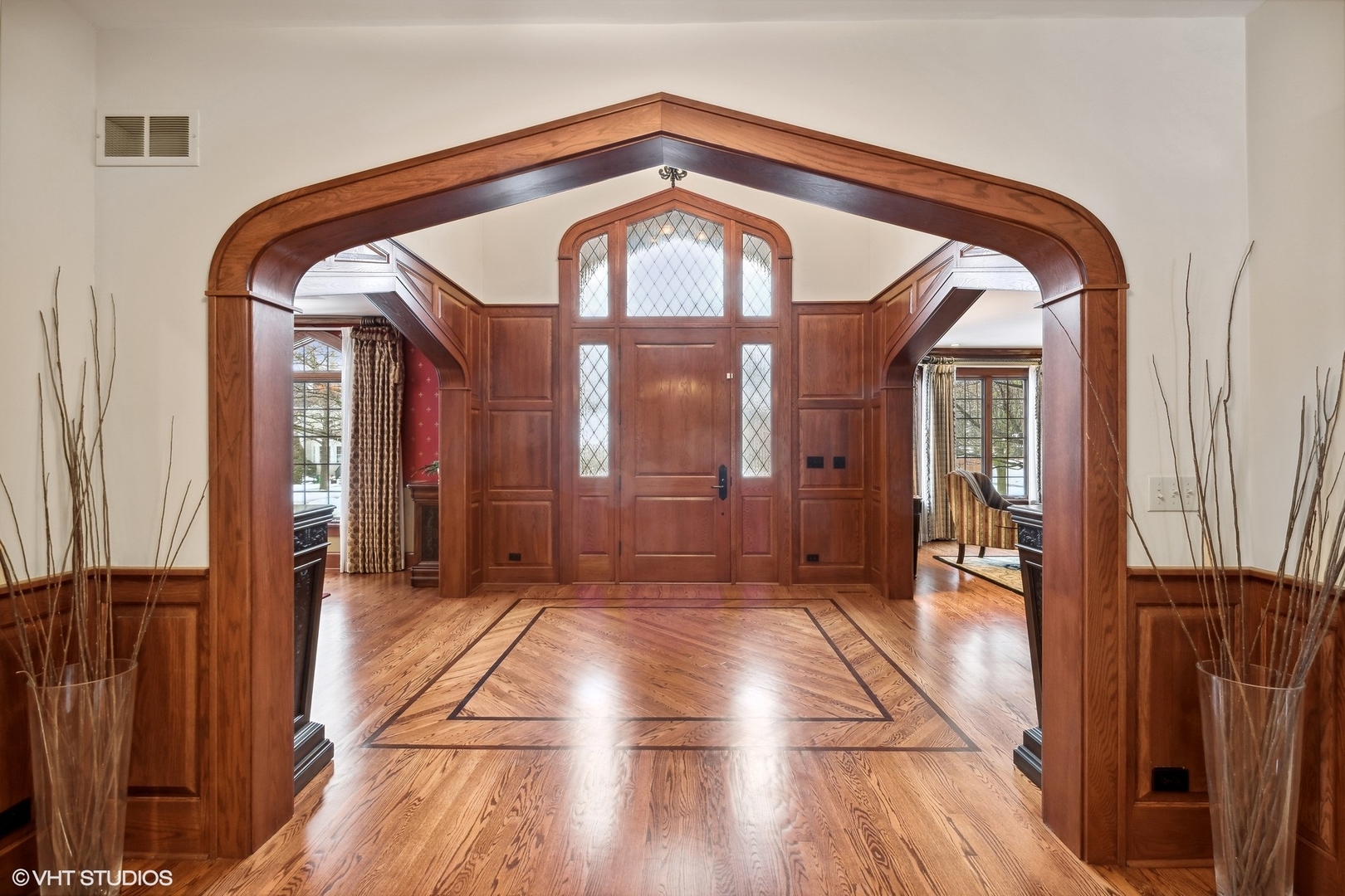 381 Argyle Avenue Elmhurst, IL 60126 - Photo 3 of 63 a view of a hallway with wooden floor and a front door