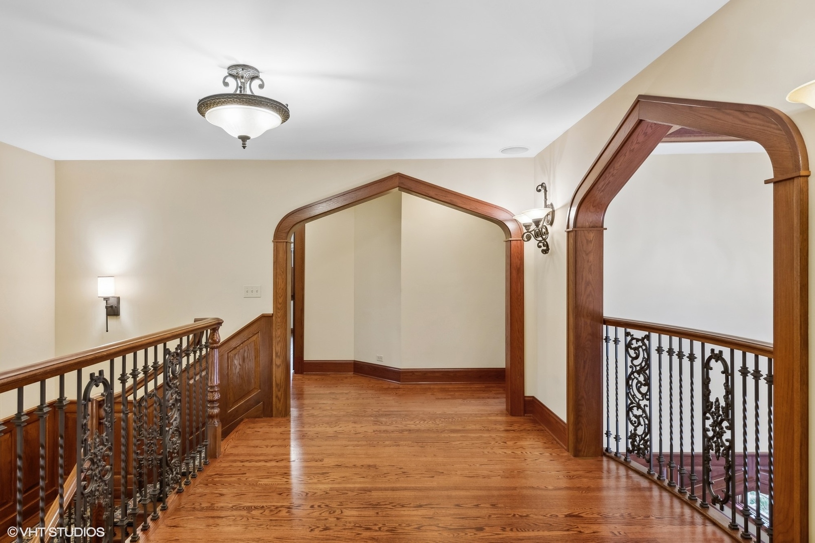 381 Argyle Avenue Elmhurst, IL 60126 - Photo 33 of 63 a view of a hallway with wooden floor and staircase