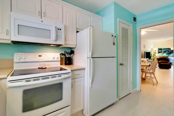 a kitchen with a stove and a refrigerator