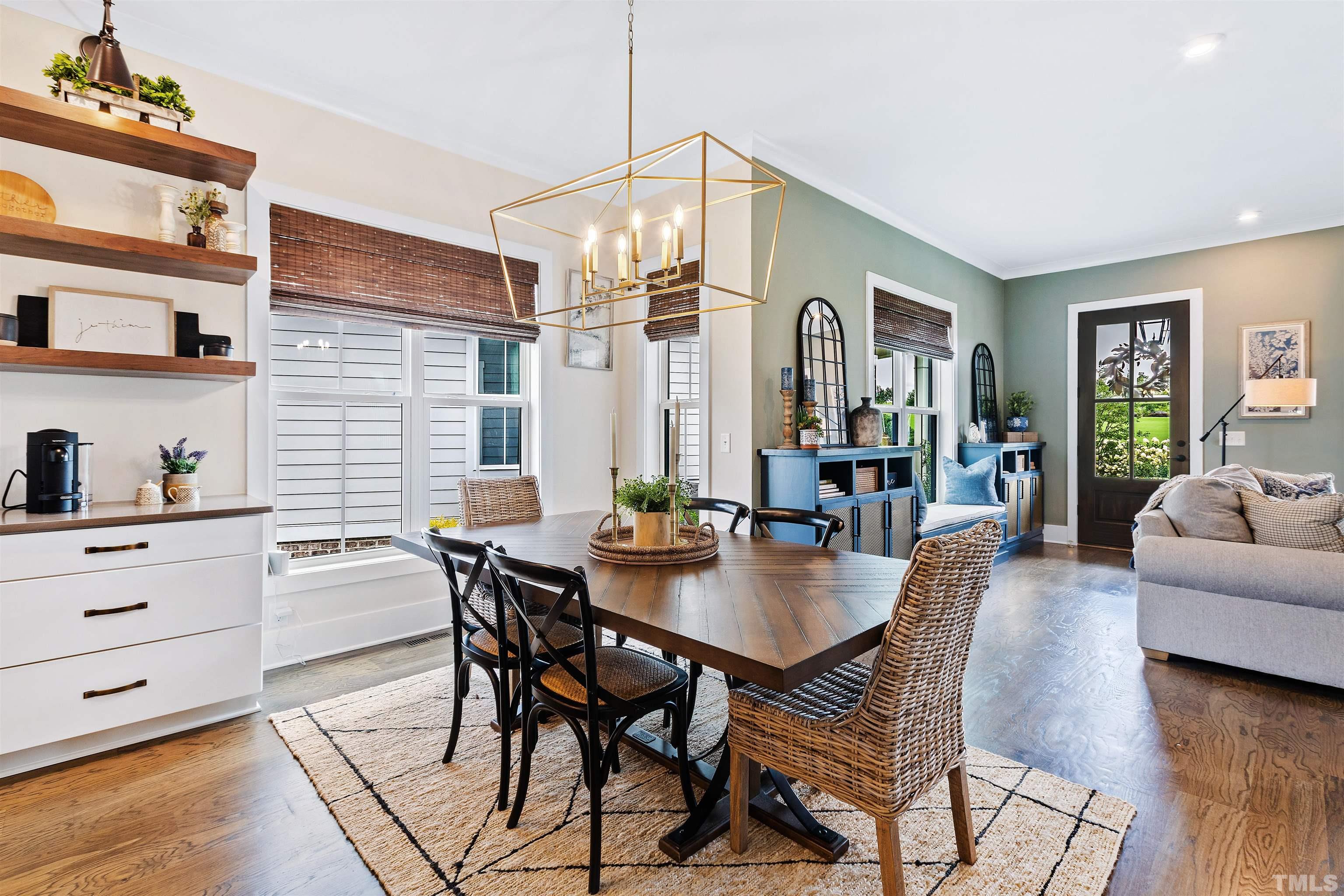 700 Daniel Ridge Rd. Wendell, NC 27591 - Photo 14 of 62 a view of a dining room with furniture and wooden floor