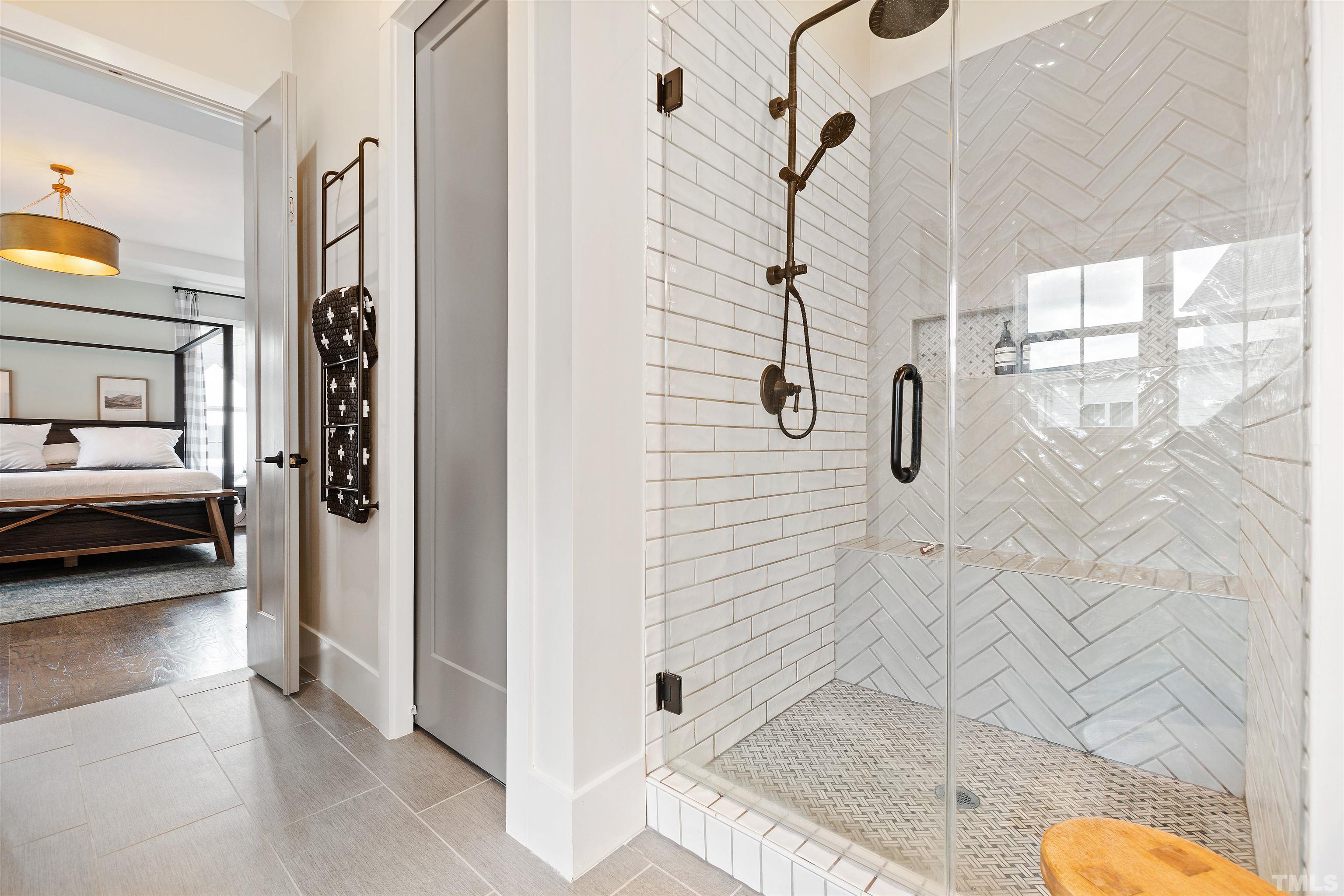 700 Daniel Ridge Rd. Wendell, NC 27591 - Photo 30 of 62 a bathroom with a tub shower and a sink