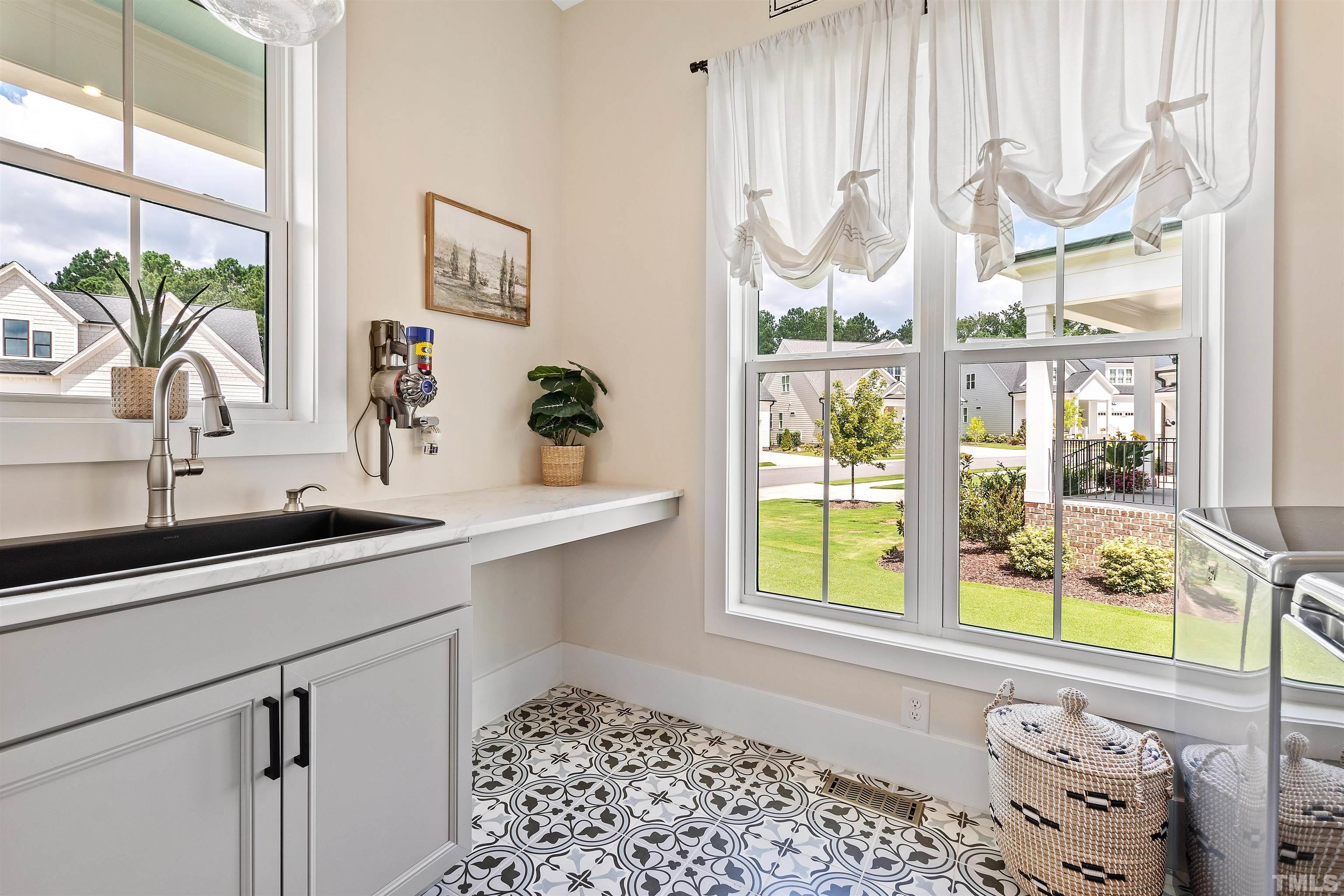 700 Daniel Ridge Rd. Wendell, NC 27591 - Photo 34 of 62 a bathroom with a sink and a large window