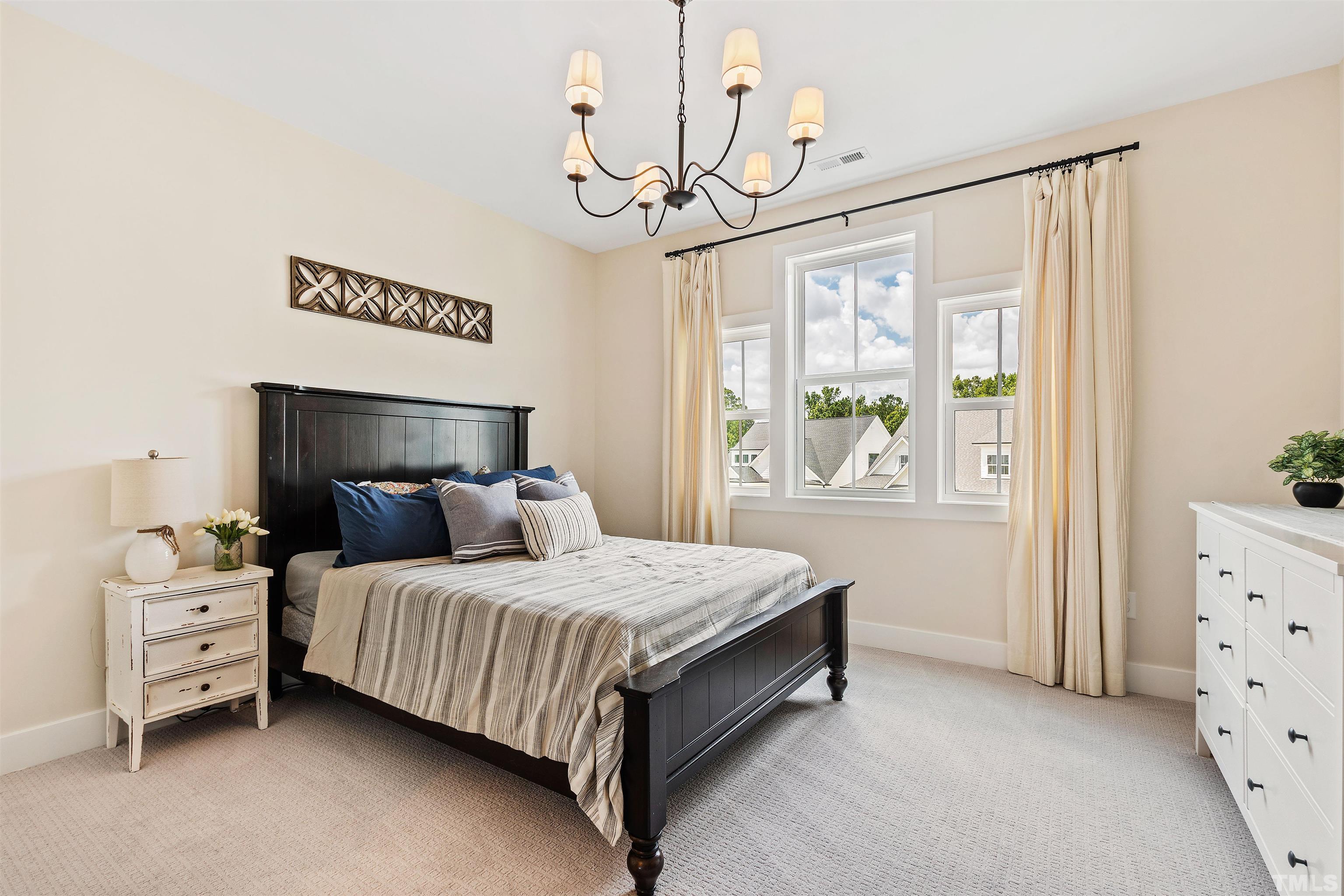 700 Daniel Ridge Rd. Wendell, NC 27591 - Photo 40 of 62 a bedroom with a bed and a window