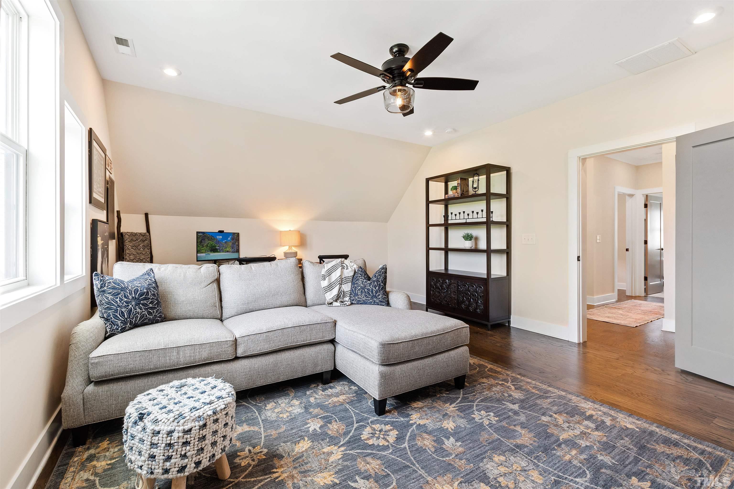 700 Daniel Ridge Rd. Wendell, NC 27591 - Photo 44 of 62 a living room with furniture and a rug