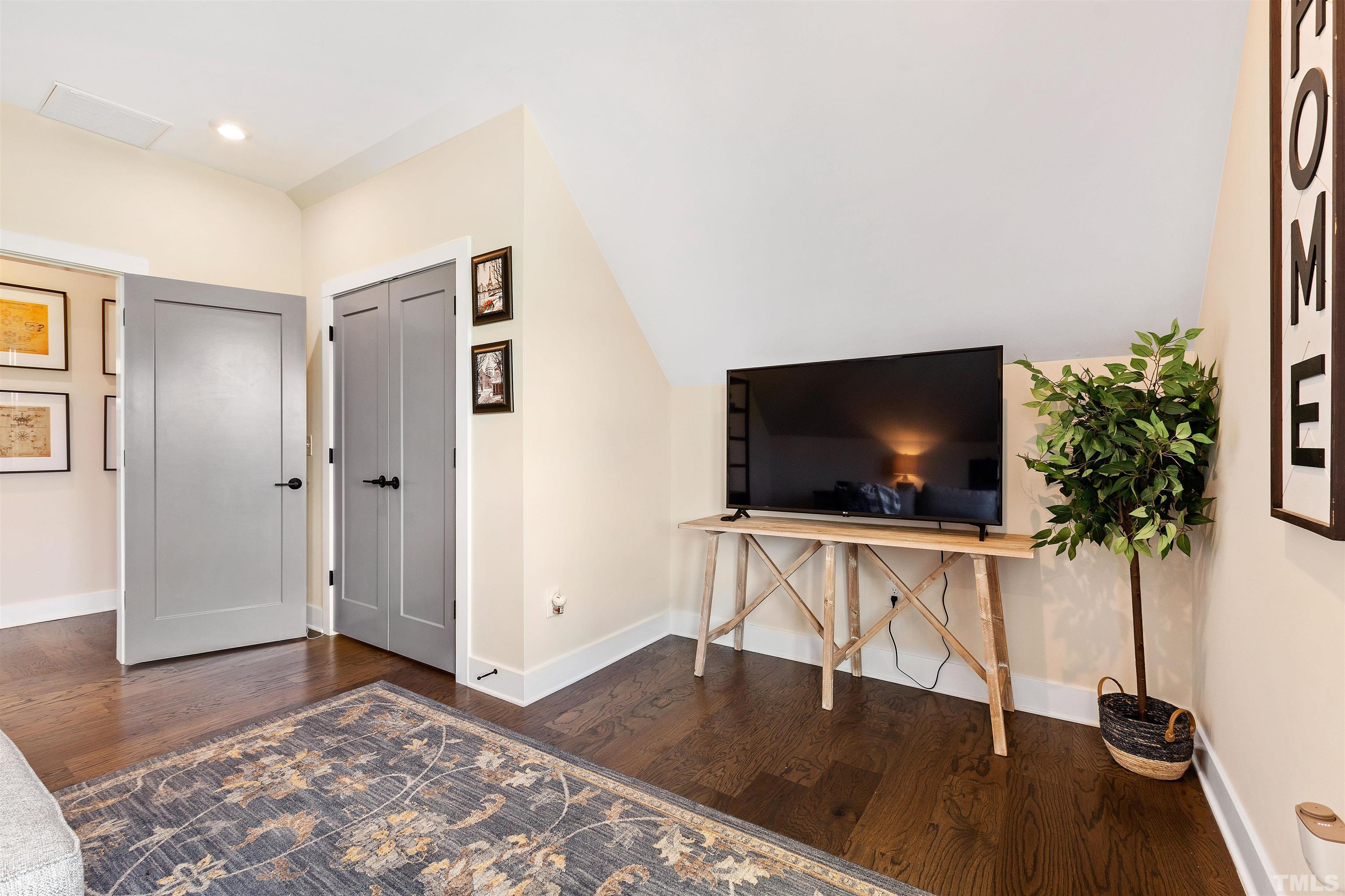 700 Daniel Ridge Rd. Wendell, NC 27591 - Photo 46 of 62 a living room with furniture and a flat screen tv