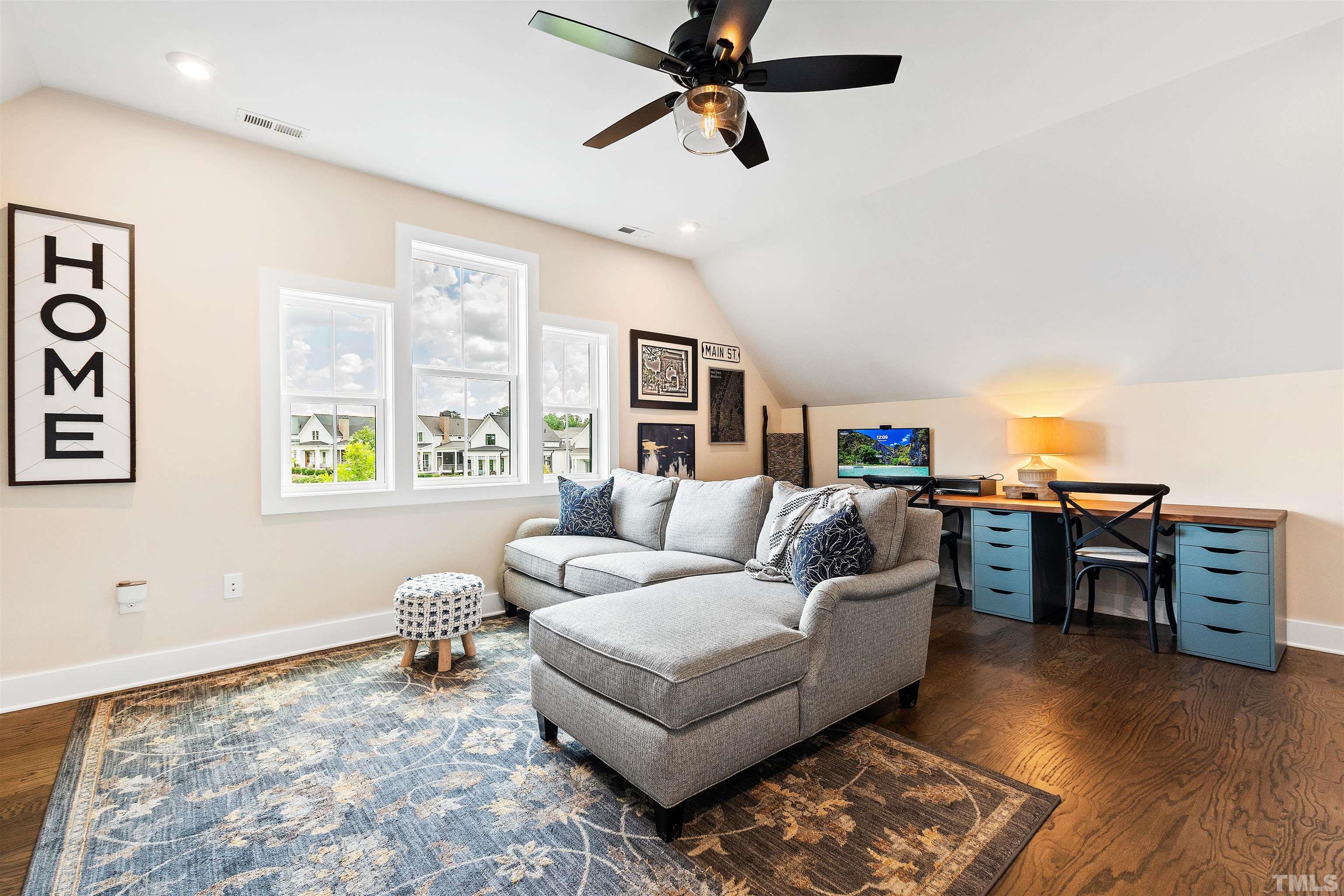 700 Daniel Ridge Rd. Wendell, NC 27591 - Photo 47 of 62 a living room with furniture and a wooden floor
