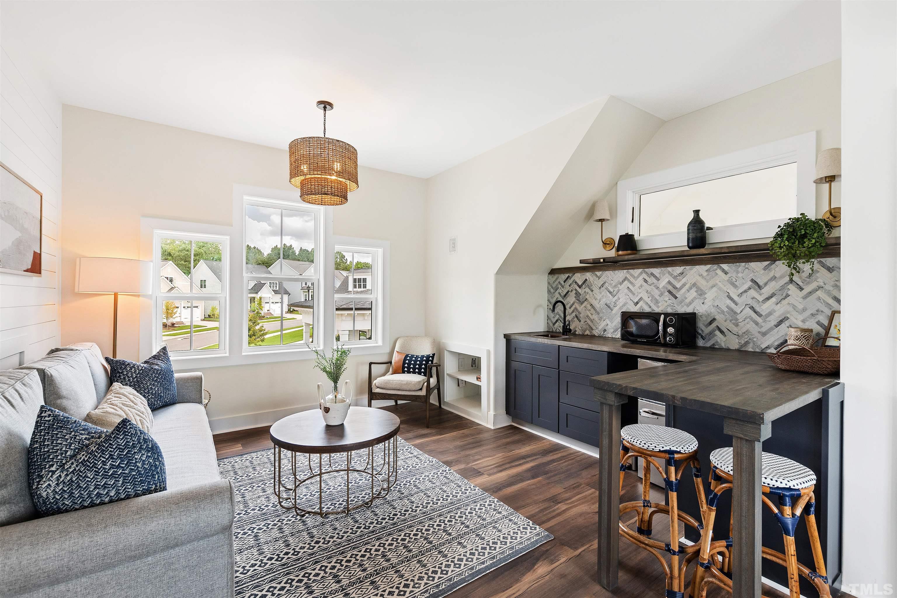 700 Daniel Ridge Rd. Wendell, NC 27591 - Photo 51 of 62 a living room with furniture and a table