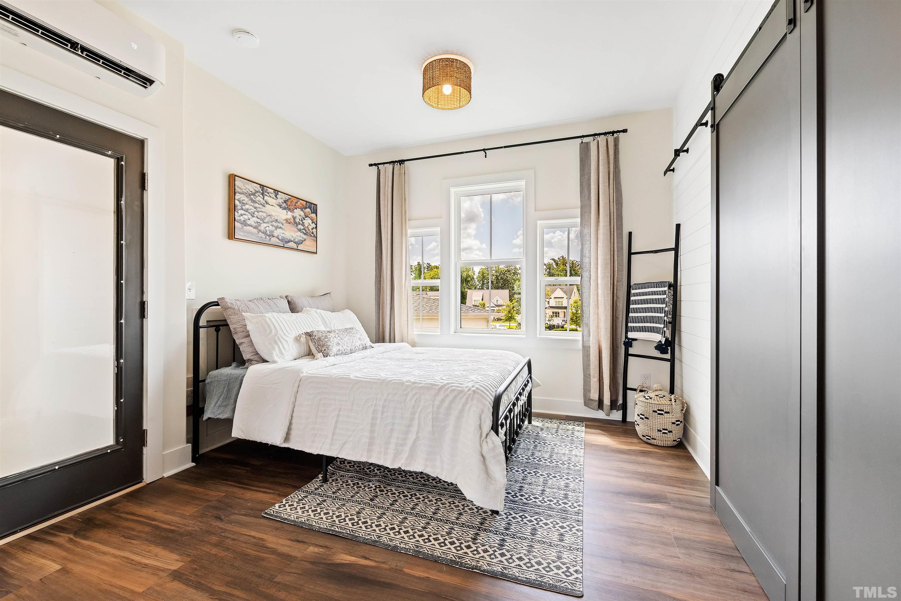 700 Daniel Ridge Rd. Wendell, NC 27591 - Photo 52 of 62 a bedroom with a bed and a window
