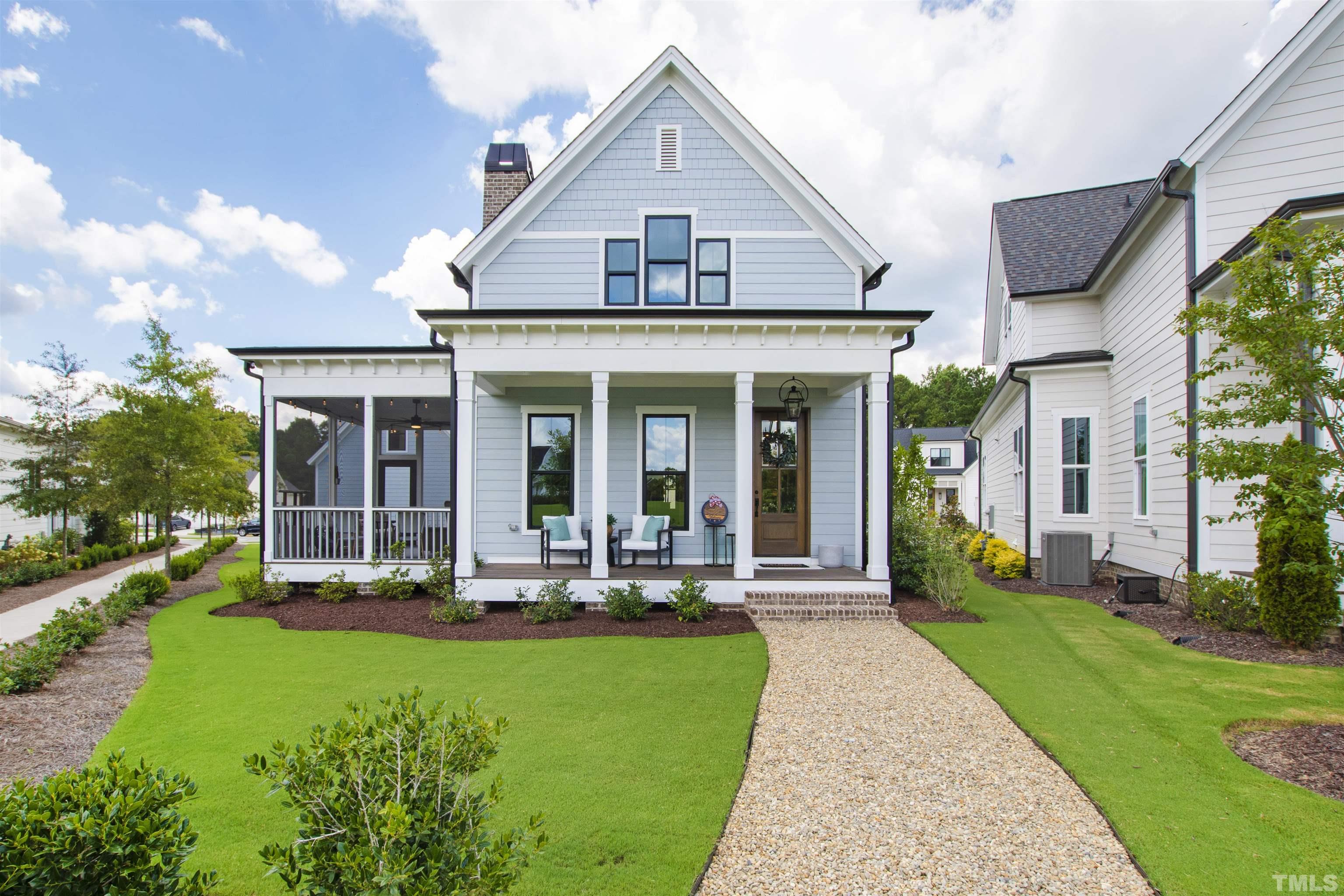 700 Daniel Ridge Rd. Wendell, NC 27591 - Photo 55 of 62 a front view of a house with garden and porch