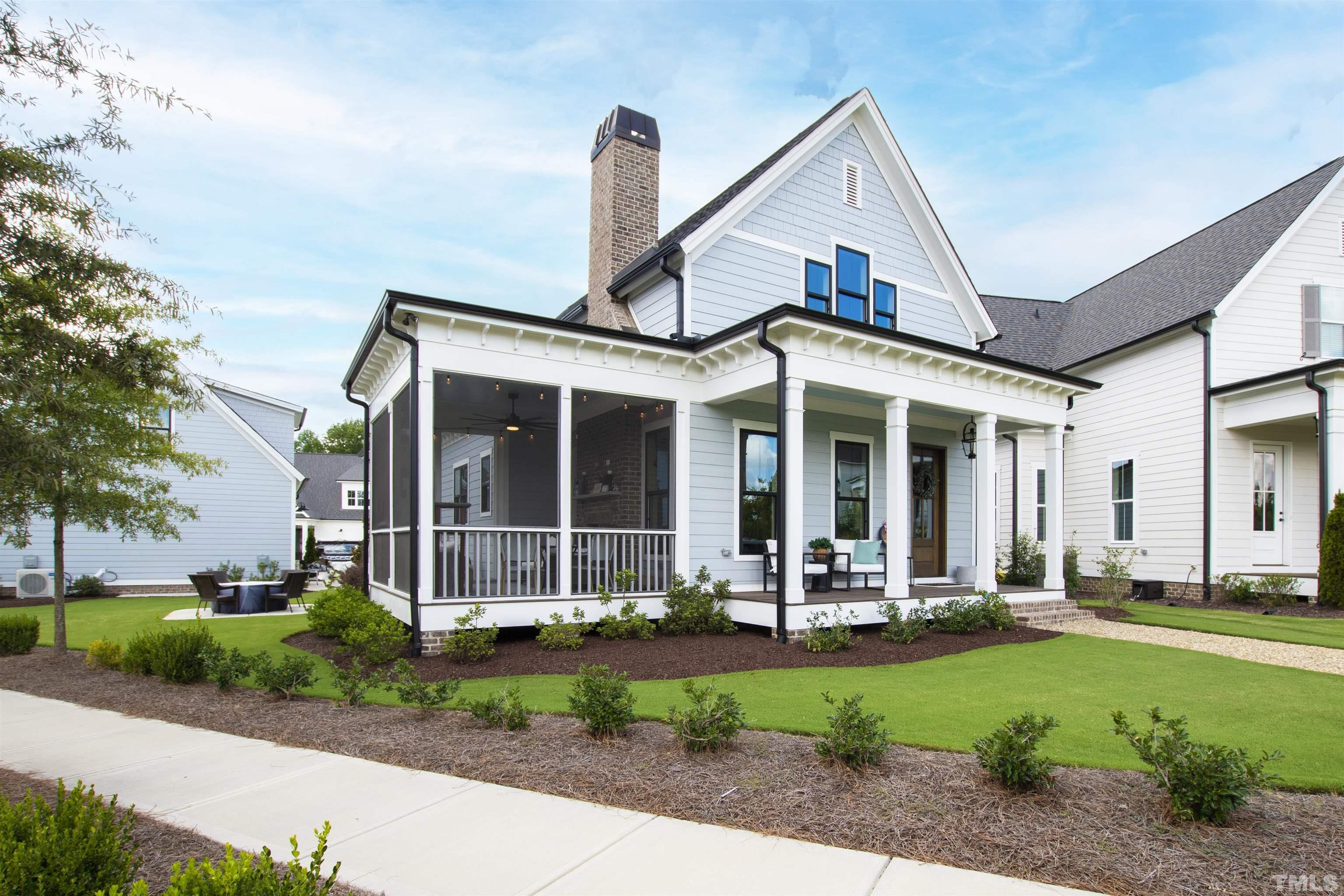 700 Daniel Ridge Rd. Wendell, NC 27591 - Photo 57 of 62 a front view of a house with garden and porch