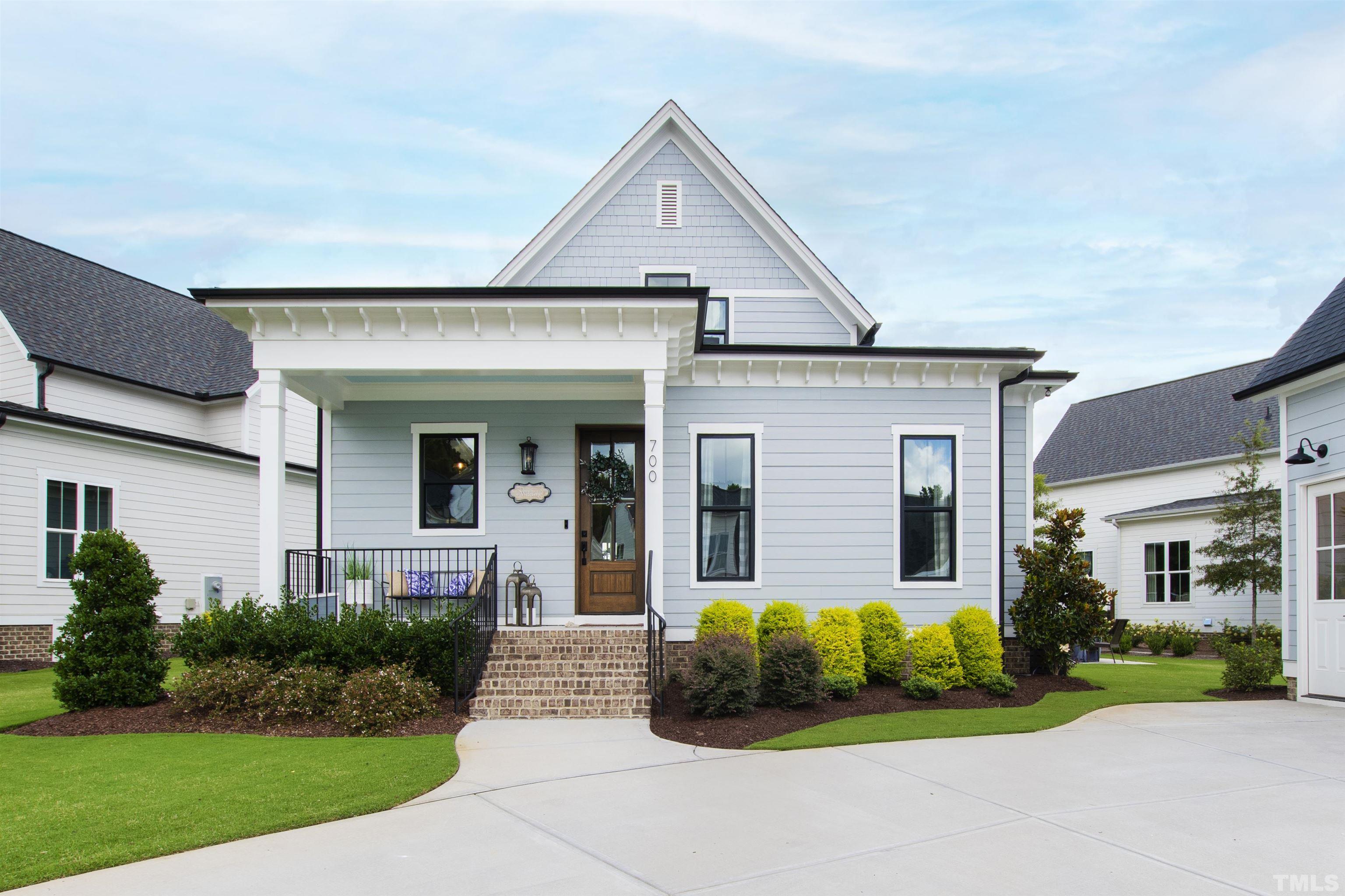 700 Daniel Ridge Rd. Wendell, NC 27591 - Photo 59 of 62 a front view of a house with a yard and garage