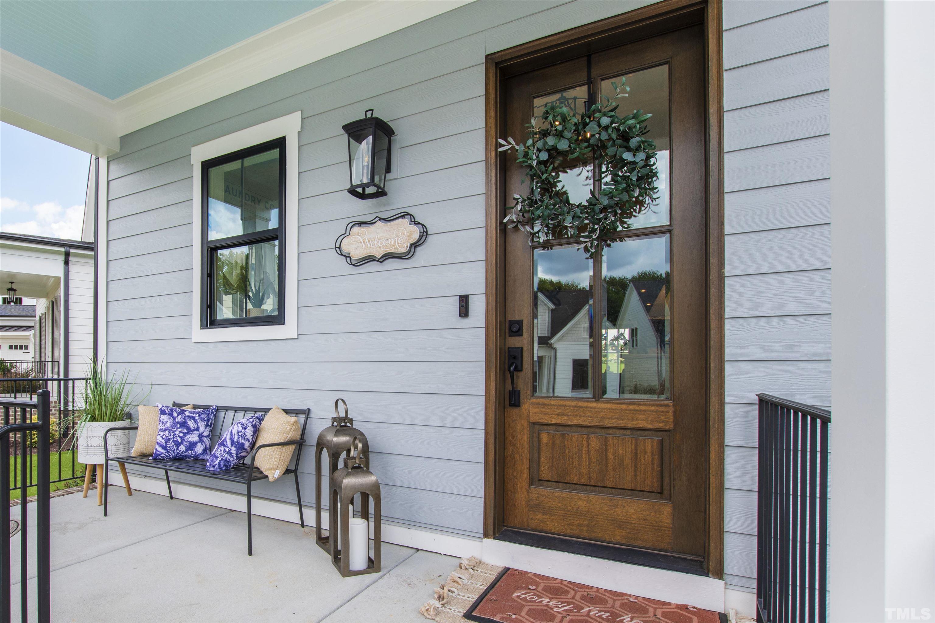 700 Daniel Ridge Rd. Wendell, NC 27591 - Photo 7 of 62 a front view of a house with outdoor seating