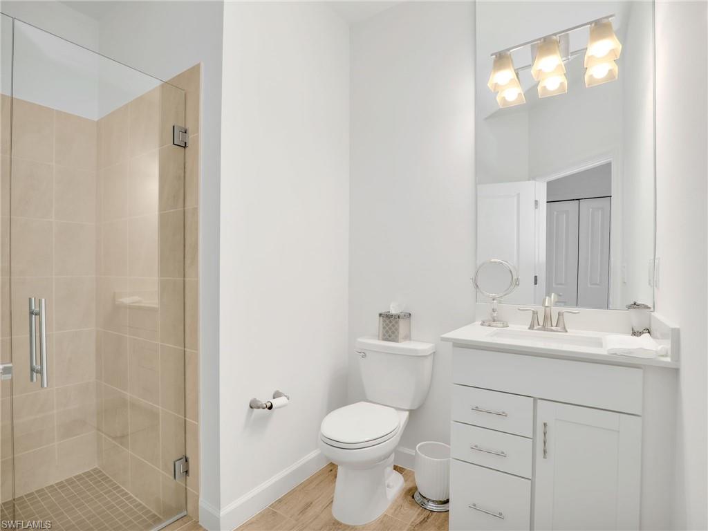 18278 Ridgeline Drive Estero, FL 33928 - Photo 23 of 45 a bathroom with a toilet sink and mirror
