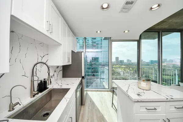 a open kitchen with a large window