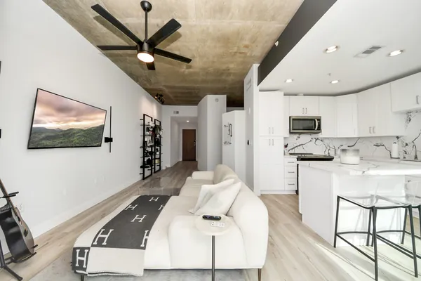 a living room with furniture and a flat screen tv
