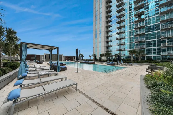 a view of swimming pool with outdoor seating