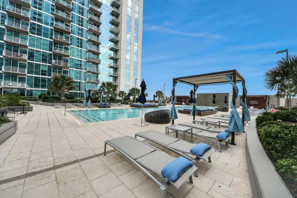 a view of multi story residential apartment building with a yard
