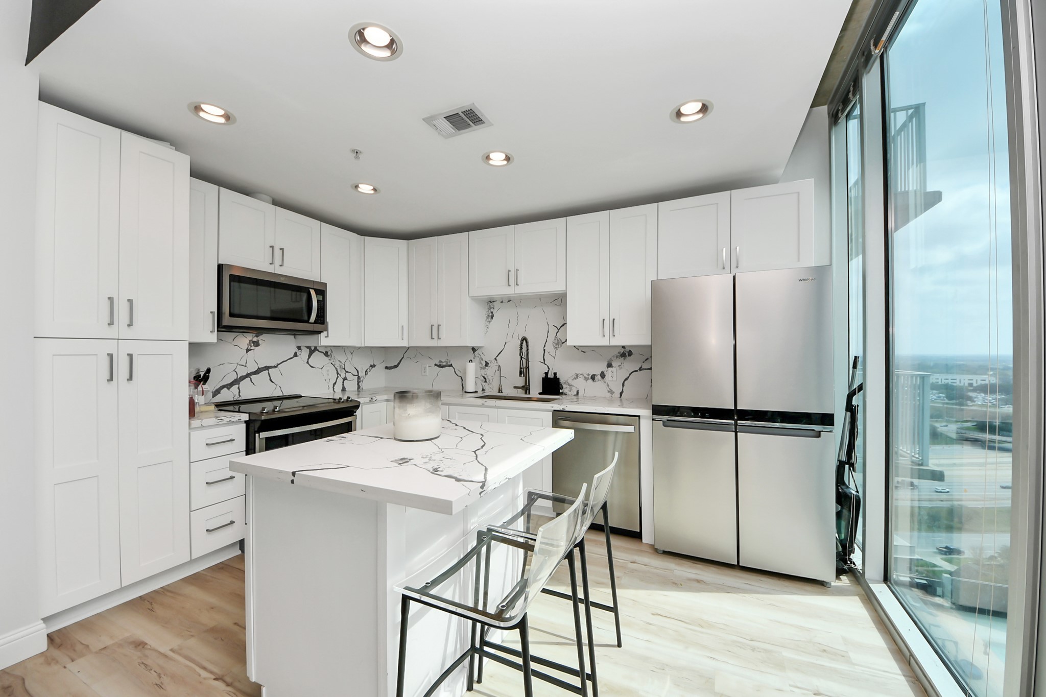 5925 Almeda Road, Unit 11616 Houston, TX 77004 - Photo 7 of 39 a kitchen with stainless steel appliances a refrigerator stove microwave and cabinets