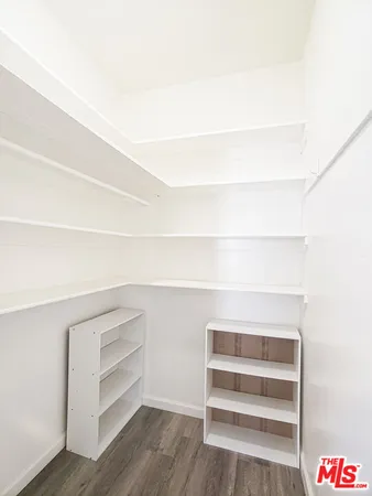 a view of an empty walk in closet