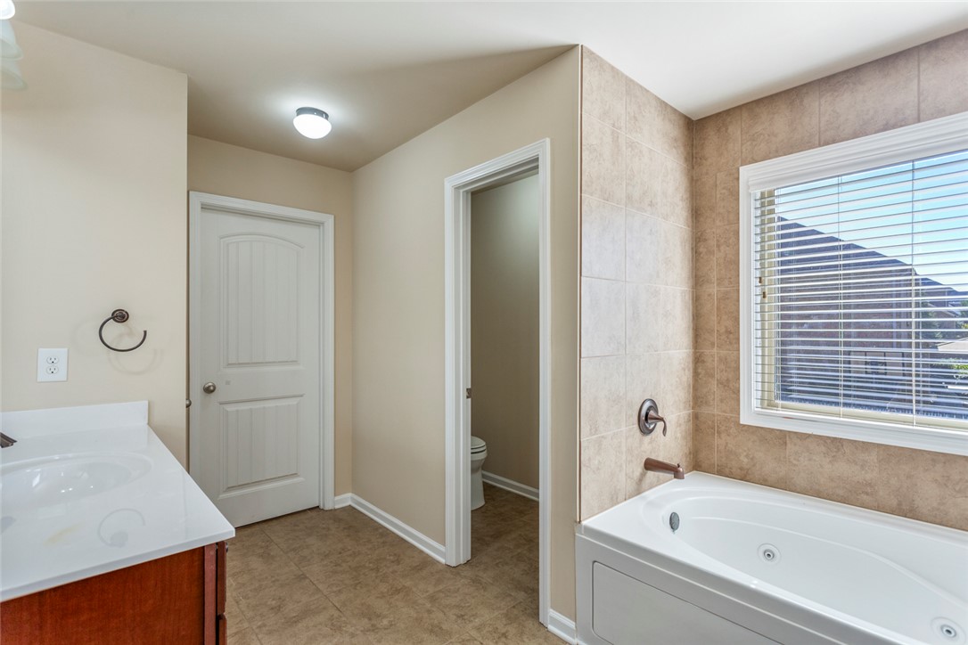 1005 Winmar Drive Anderson, SC 29621 - Photo 34 of 50 This serene bathroom offers a spacious soaking tub, vanity, and ample natural light.
