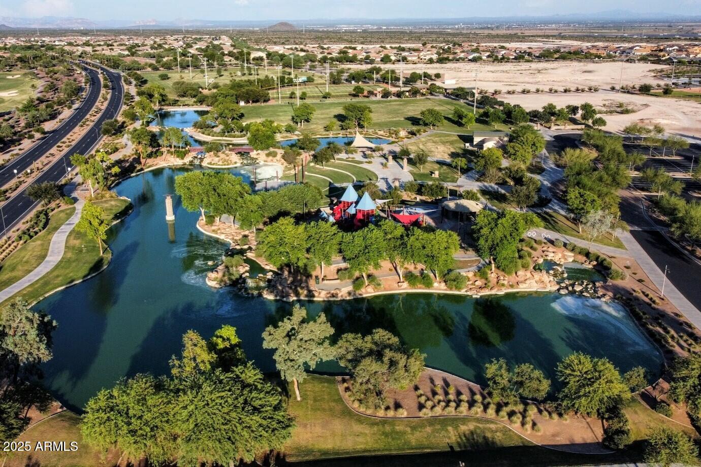 8459 West Gehrig Way Florence, AZ 85132 - Photo 37 of 37 an aerial view of a houses with a lake view