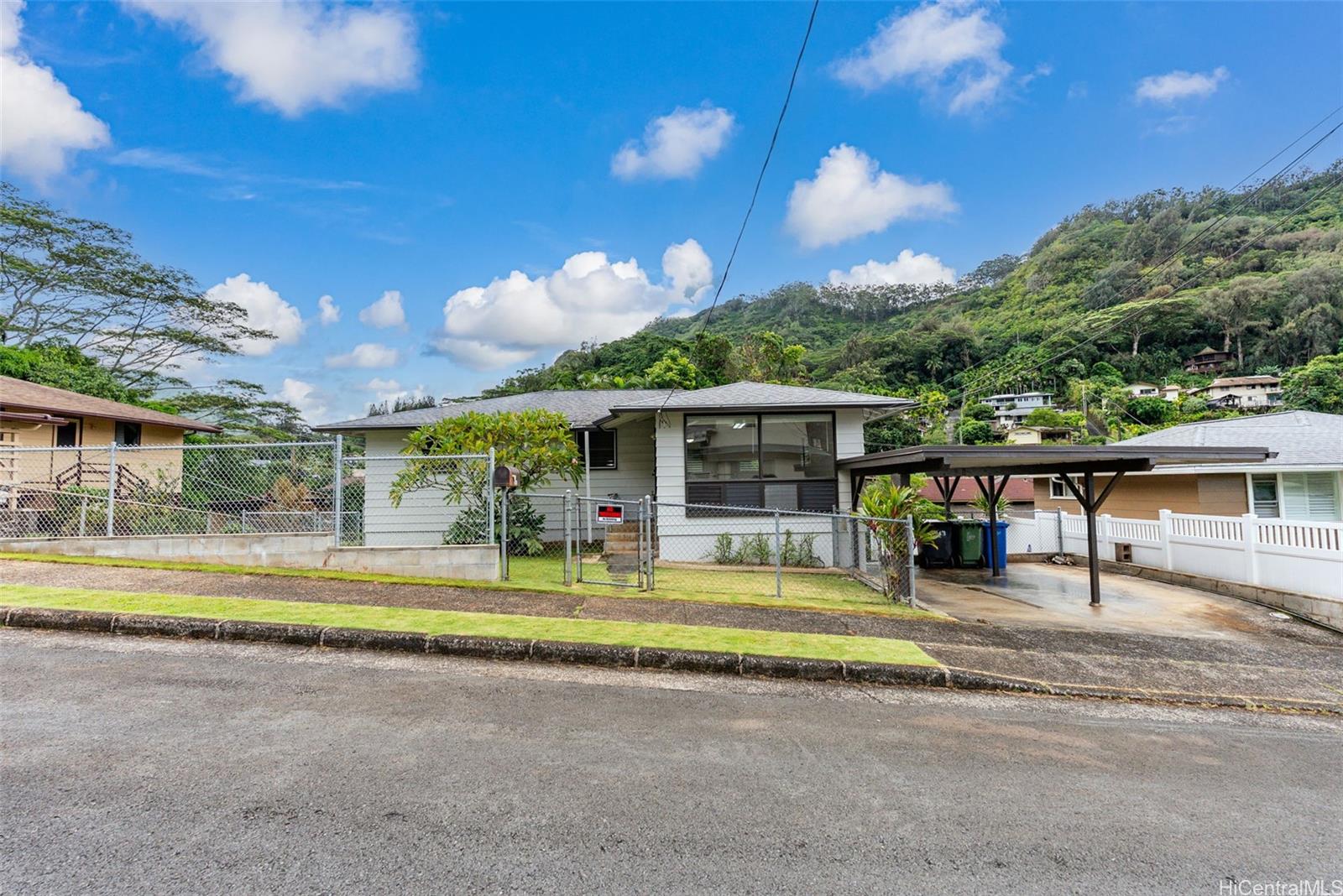 3043 Numana Road Honolulu, HI 96819 - Photo 1 of 1 a view of an chairs and tables in the patio